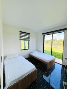 Ένα ή περισσότερα κρεβάτια σε δωμάτιο στο Villa Bella Verde ll