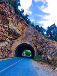 a road going through a tunnel in a mountain at Welkom ketama hermano in Tlata Ketama