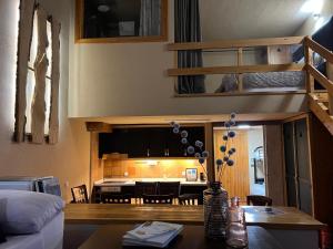 a living room with a couch and a table at LF LEVEL Sierra Nevada Duplex in Sierra Nevada