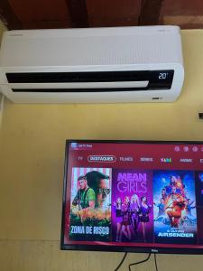 a picture of a movie on top of a printer at Flat Maricá com ar-condicionado in Maricá