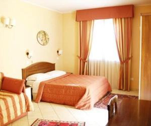 Postel nebo postele na pokoji v ubytování Greta Rooms Hotel