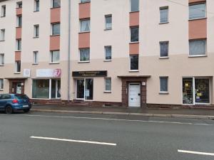 a building on the side of a street at FeWo WIEKO Plauen Leibnizstr. H3, DG links in Plauen