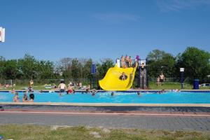 a group of people in a pool at a water park at Lila aan zee - Recreatiepark de Watersnip in Petten