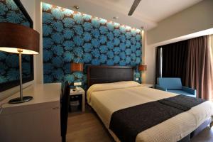 Postel nebo postele na pokoji v ubytování Corfu Mare Hotel -Adults only + 37 fotografií
