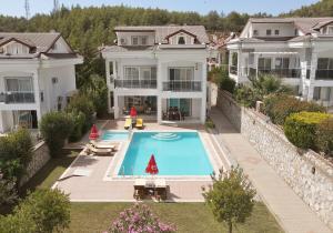 an aerial view of a house with a swimming pool at Villa Raya 1 in Fethiye