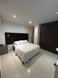 Postel nebo postele na pokoji v ubytování Hotel Sun Suite