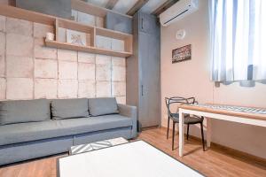 a living room with a couch and a table at 1bdr Trendy Interior Vitoshka Area Ac in Sofia
