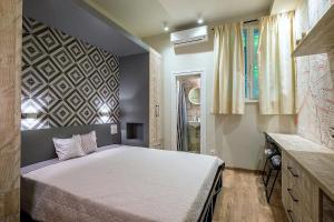 a bedroom with a large bed and a wall at 1bdr Trendy Interior Vitoshka Area Ac in Sofia