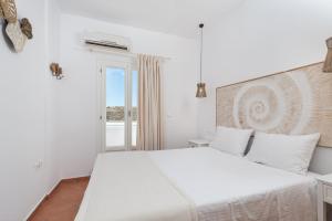Posteľ alebo postele v izbe v ubytovaní Cycladic Luxurious Maisonette