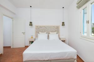 Posteľ alebo postele v izbe v ubytovaní Cycladic Luxurious Maisonette