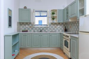Kuchyňa alebo kuchynka v ubytovaní Cycladic Luxurious Maisonette