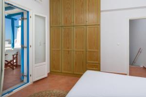 Posteľ alebo postele v izbe v ubytovaní Cycladic Luxurious Maisonette