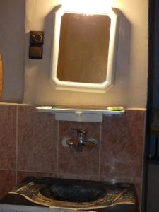 Um banheiro em Auberge Sahara