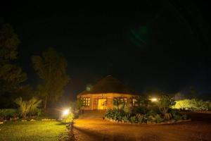a large house at night with lights at Nile treatz hotel in Pakwach East