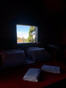 Llit o llits en una habitació de Chalés Serra do Trovão
