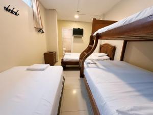 Voodi või voodid majutusasutuse Hostal Posada Del Sol toas