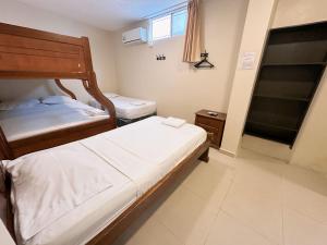 Voodi või voodid majutusasutuse Hostal Posada Del Sol toas