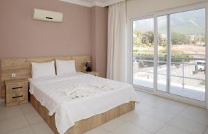 Ένα ή περισσότερα κρεβάτια σε δωμάτιο στο Villa Raya 1 +16 φωτογραφίες