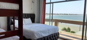 Postel nebo postele na pokoji v ubytování Hotel Paradise Beach