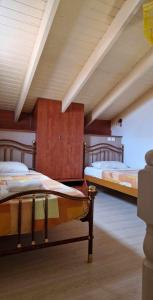 a room with two beds in a room with ceilings at ABC Sweet Home in Sidari