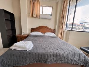מיטה או מיטות בחדר ב-Hostal Posada Del Sol