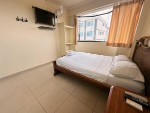 Voodi või voodid majutusasutuse Hostal Posada Del Sol toas