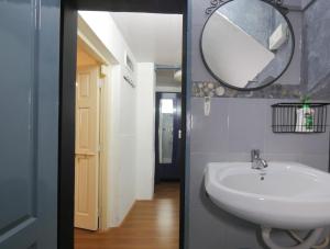 a bathroom with a sink and a mirror on the wall at Ranger - Bandra West in Mumbai +28 photos