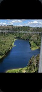 an aerial view of a river with a bridge at Panoramic Aparthotel in Braunlage +4 photos