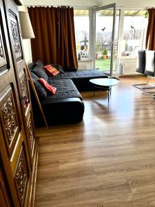 a living room with a couch and a table at Panoramic Aparthotel in Braunlage