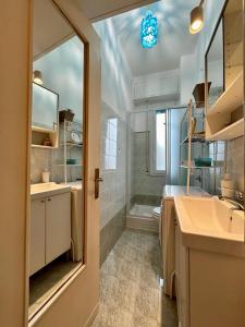 a bathroom with a sink and a shower at Kibilù - Via Quattro Novembre in Corsico