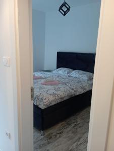 Posteľ alebo postele v izbe v ubytovaní Vila Leona B-0