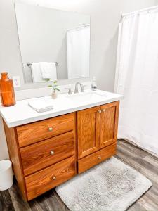 a bathroom with a sink and a mirror at Remodeled Downtown 3bed Home Quartz Countertops in Boise +20 photos