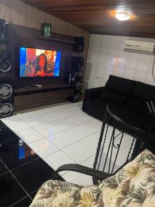 TV a/nebo společenská místnost v ubytování Cobertura central /com ar