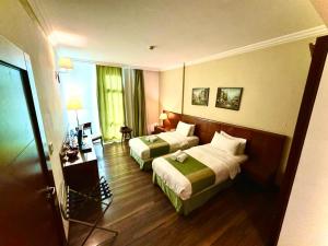 Voodi või voodid majutusasutuse King Suites Hotel toas