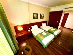 Voodi või voodid majutusasutuse King Suites Hotel toas