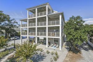 an aerial view of a large white building at Hotel Pass Christian Queen Suite 305 in Pass Christian