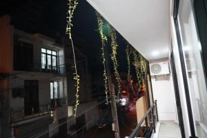a hallway with a view of a building with lights at Sai Sruthi Residences in Colombo