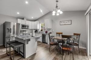 a kitchen with a table and chairs and a dining room at Pet Friendly and Spacious Valley View Family Home in Snohomish