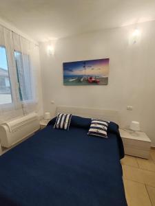 Ένα ή περισσότερα κρεβάτια σε δωμάτιο στο ONDINA APARTMENT IN VERSILIA