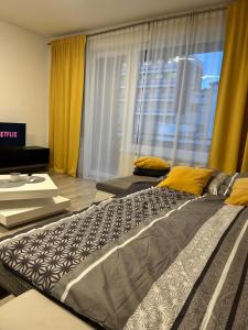 a large bed in a room with a window at AR RADNICA HOUSE in Košice