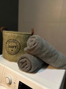 a towel sitting on top of a washing machine at AR RADNICA HOUSE in Košice