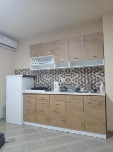 Una cocina o cocineta en Vezir apartman