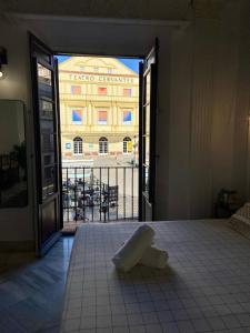a room with a view of a large building at Casa Cervantes Malaga in Málaga
