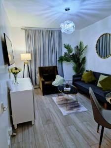 a living room with a couch and a table at 1 bedroom flat London in London