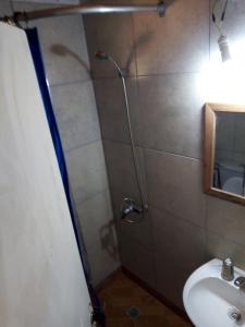 a bathroom with a shower and a sink at Hospedaje San Mayol 