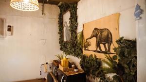 a room with a painting of an elephant on the wall at Space ARA in Seoul