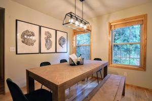 a dining room with a wooden table and chairs at River Rock Chalet :: Hot Tub, Pets, Stevens Pass in Skykomish
