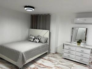 Letto o letti in una camera di Moderno Apt en la ciudad