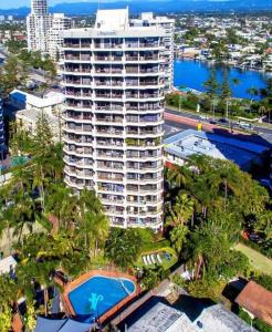 an aerial view of a tall building with a pool at Serenity by the Sea in Gold Coast