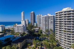 a city skyline with tall buildings and the ocean at Serenity by the Sea in Gold Coast